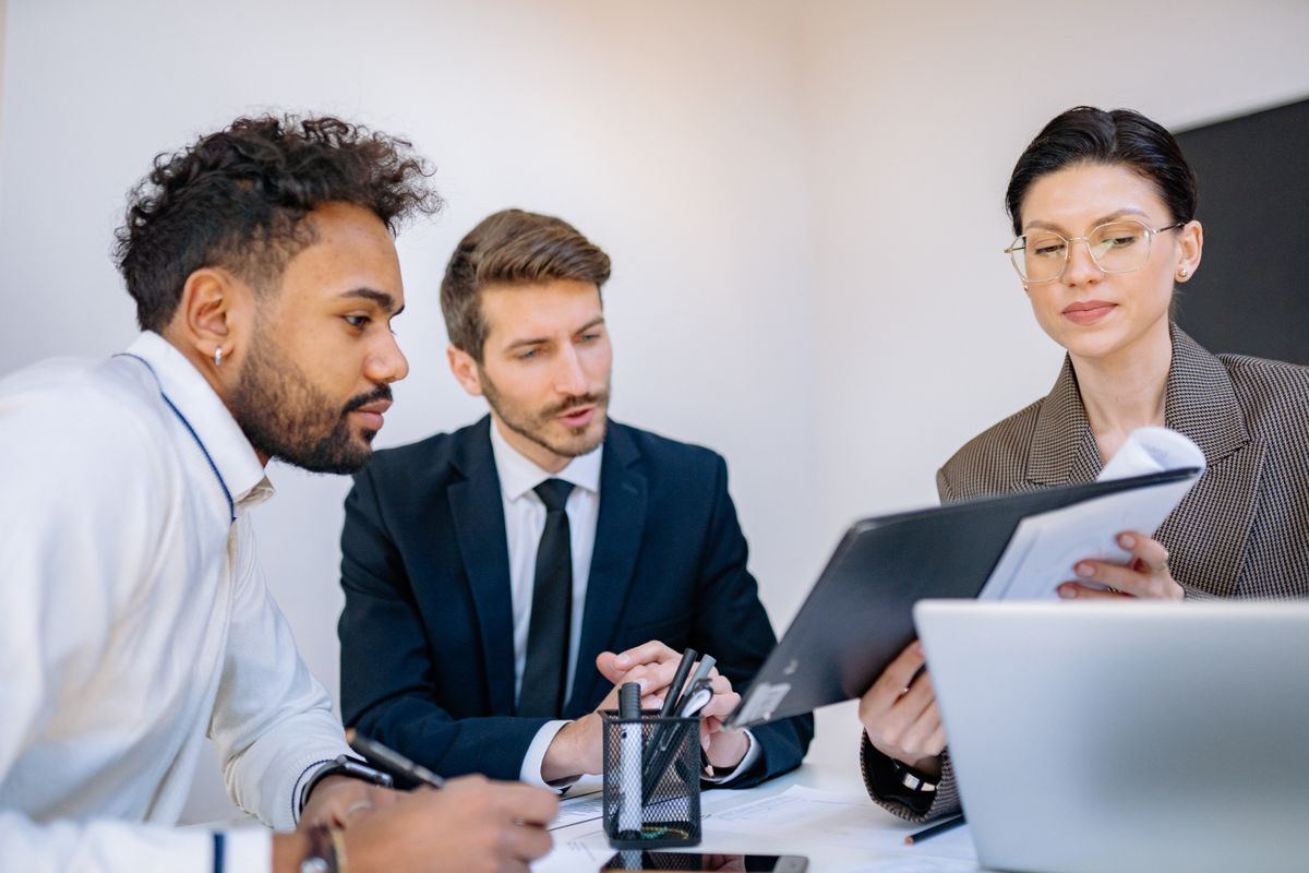 Colleagues discussing findings at a desk